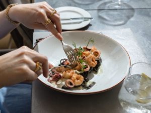 Black fettuccine with shrimp, squid and cheese foam at Royal Crown Grill House