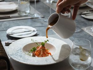 Creamy shrimp bisque being served at Royal Crown Grill House in Dubrovnik