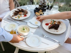 Guests enjoying premium grilled specialties at Royal Crown Grill House in Dubrovnik