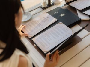 Guest reading the menu at Sunset Restaurant in Dubrovnik