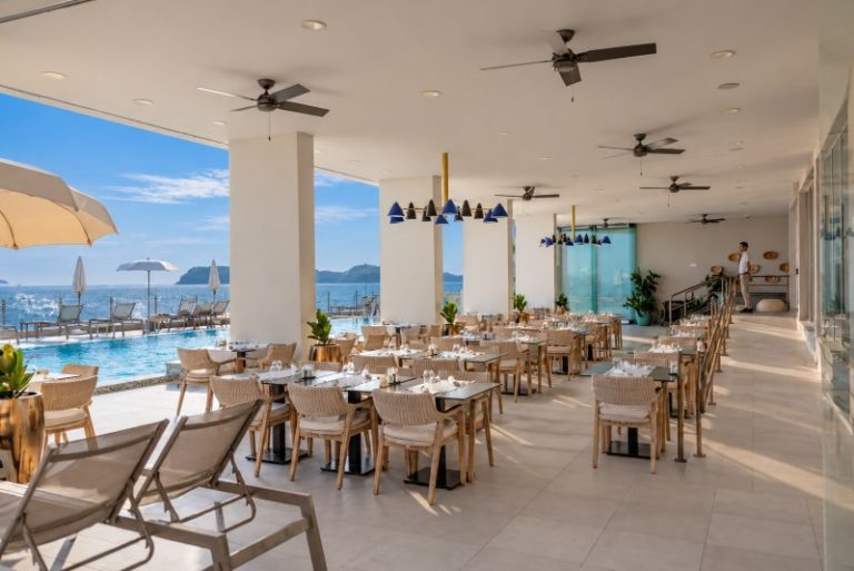 Bright and elegant interior of Vista Restaurant with panoramic Adriatic Sea views at Royal Blue Hotel Dubrovnik