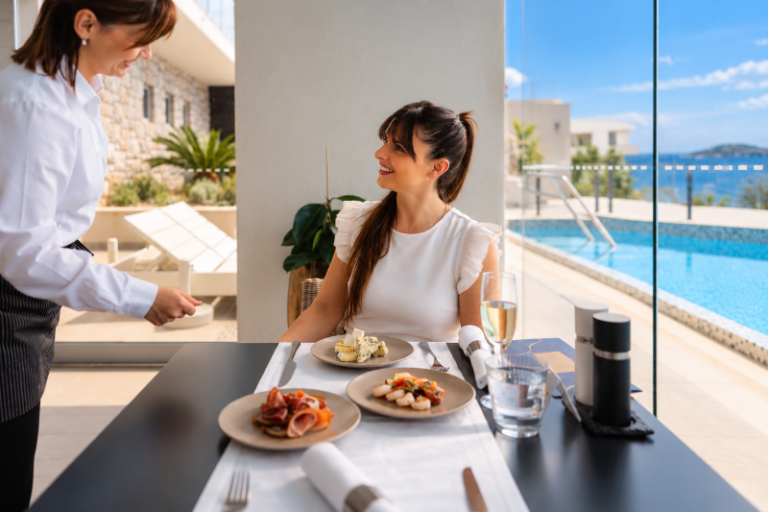 Guest enjoying gourmet breakfast with Adriatic Sea views at Vista Restaurant in Dubrovnik